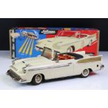 Boxed Schuco Synchromatic 5700 tin plate Packard model with white body and beige fins, red interior,