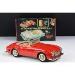 Original boxed Schuco 5503 Elektro Phanomenal tin plate car in red with 4 x wooden pegs & remote