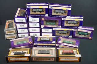 24 Boxed Dapol OO gauge items of rolling stock to include various wagons and vans, some box wear