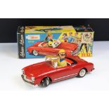 Original boxed Schuco 5735 Texi tin plate model in red male driver with driver in yellow cap, 3 x