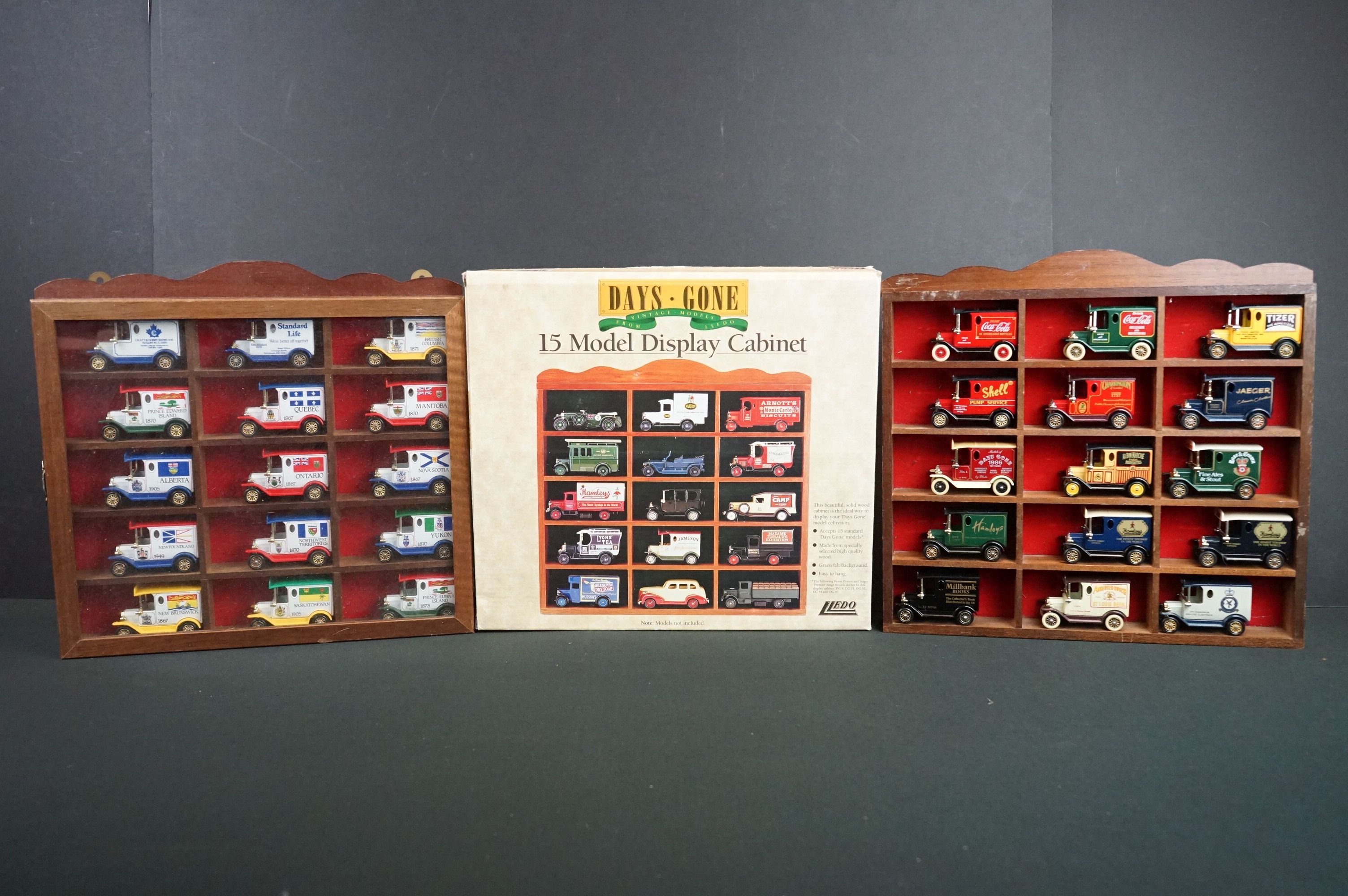 Three Lledo display cases, one boxed, one containing 15 x Canadian series diecast models, another