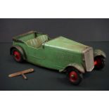 Early to mid 20th C 1936 Ford model car in green, construction built, clockwork with key, approx.