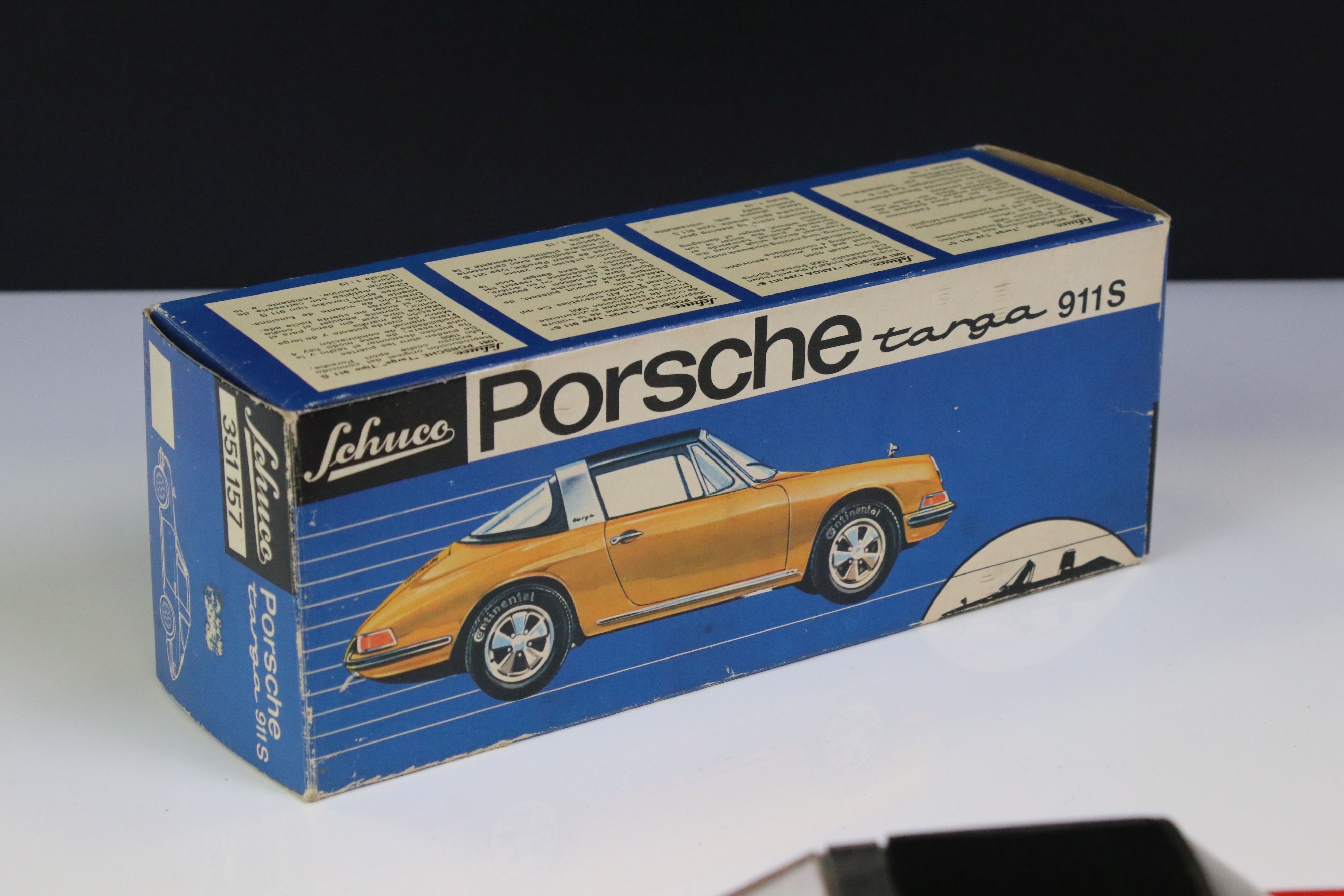 Boxed Schuco clockwork Porsche Targa 911S in red with black roof, vg condition with only minor paint - Bild 7 aus 8