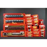 25 Boxed Hornby / Triang OO gauge items of rolling stock to include R416 Operating Mail Coach BR