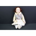 Early 20th C bisque headed doll with blue glass eyes marked PD 1/2 9 to neck, soft bodied with