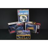 Four Boxed & unbuilt TV-related plastic model kits to include 2 x AMT model kits (S958 Star Trek