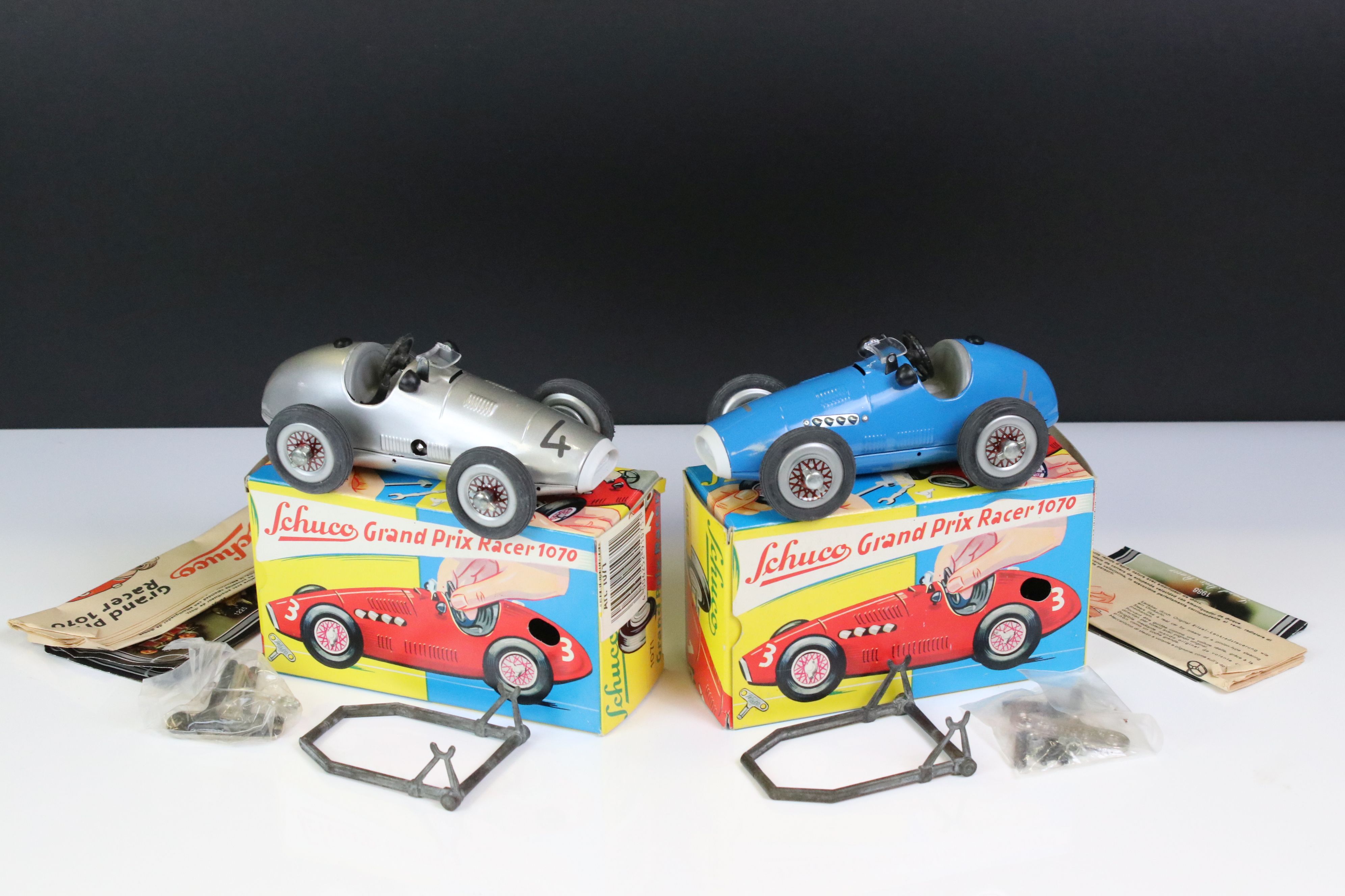Two boxed Schuco Grand Prix Racer clockwork tin plate models to include 1071 in silver and 1070 in