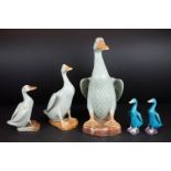 Three Graduating Chinese Celadon Glazed Models of Ducks, tallest approx 30cm, together with a pair