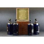 George III Mahogany Square Four Section Decanter Box fitted with Four Bristol Blue Spirit