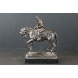 Bronzed spelter jockey on horseback, mounted on a marble base