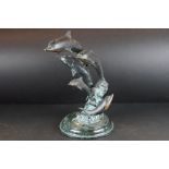 Bronze Sculpture of Five Leaping Dolphins raised on a marble effect base, 38cm high