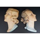 Two 1930s Art Deco plaster face mask wall plaques, depicting two young ladies with vibrant red