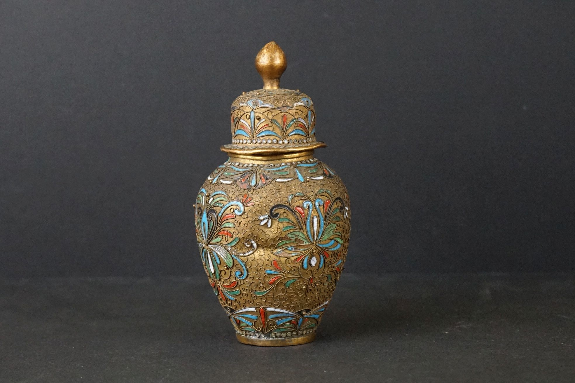 An Oriental Cloisonné and gilt decorative lidded vase.