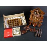 A small group of mixed collectables to include a cuckoo clock, a desk clock and a collection of