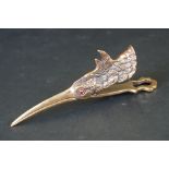 Brass document clip in the form of a water bird