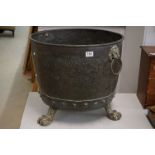 Large Riveted Copper Log Bucket with Brass Lion Ring Handles and raised on three Brass Lion Paw