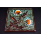 Tilgmans of Sweden glazed pottery wall plaque depicting a thistle on mottled green ground, approx