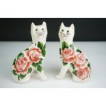 Two Griselda Hill Pottery Wemyss cats decorated in the ' Cabbage Rose ' pattern, both signed ' G.