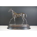 Spelter figure of a horse mid-stride, mounted on a wooden base, approx 27cm high