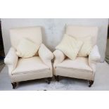 Pair of 19th century Armchairs, upholstered in in cream fabric, raised on turned legs with