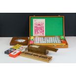 Cased Mahjong set, together with box of dominoes, solitaire board, cribbage board & four packs of