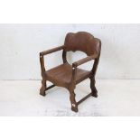 Early to Mid 20th century Elbow Chair with studded brown leather upholstered back rail, arms and
