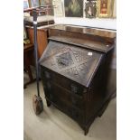 Early 20th century Oak Bureau carved with lion masks, 76cm wide x 101cm high together with a