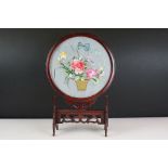 Japanese circular silk table screen depicting flowers in a basket, mounted in a hardwood frame on