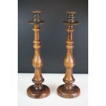 Pair of large late 19th century lignum vitae turned candlesticks with brass drip tray and sconces