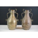 Pair of African twin-handled bottle vases with handles modelled as cobras, with engraved foliate &