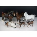 Five Beswick horse figures to include a brown gloss shire horse with saddle, reins and harness (with