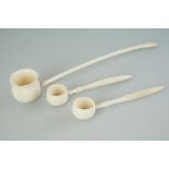 A collection of three antique carved bone miniature ladles.