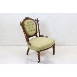 Victorian Carved Walnut Nursing Chair, with green floral button back upholstery, 51cm wide x 82cm
