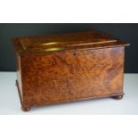 Burr walnut chest of rectangular form, with hinged two-stepped lid, raised on four bun feet,