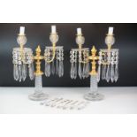 Two early 20th Century cut glass and gilt metal two-branch candelabras, with cut glass stem and