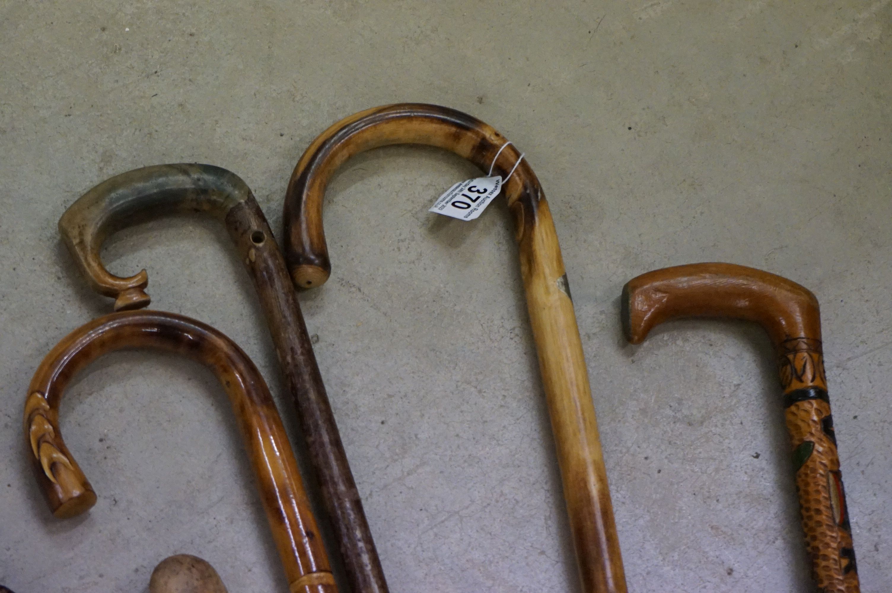 A collection of approx nine walking sticks to include a silver collard example. - Image 3 of 5
