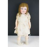 Armand Marseille bisque headed doll with sleeping blue eyes and painted face, markings to back of