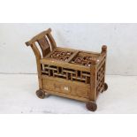 Chinese Hardwood Drink Trolley with geometric pierced sliding top opening to eight bottle spaces, on