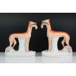 Pair of large Staffordshire lurcher dog figures