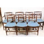 Set of Seven George III Country Chairs (including two carvers) with carved spindle backs and solid