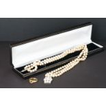 A ladies pearl necklace with sterling silver Art Deco clasp together with a hallmarked gold ring.