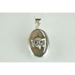 Silver photo locket pendant with embossed owl figure