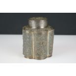 An antique ornate Chinese silver tea caddy with Repoussé decoration, character marks to base.