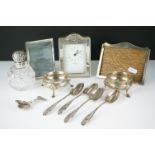 A small collection of mixed silver and silver plated items to include salts, photograph frames,