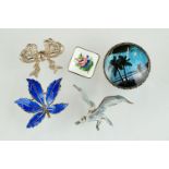 A collection of five sterling silver brooches to include two Norwegian enamel examples.