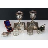 A small collection of hallmarked sterling silver collectables to include candlesticks, napkin