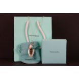 A sterling silver Tiffany & Co necklace and pendant set complete with bag, box and gift bag.