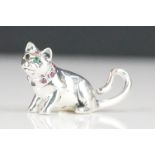 Silver cat figure with ruby collar and emerald eyes