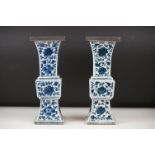 Two similar Chinese ' Gu ' shaped Blue and White Vases decorated with flowers, square white metal