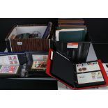 A large collection of stamps, First Day Covers and postcards contained within albums.